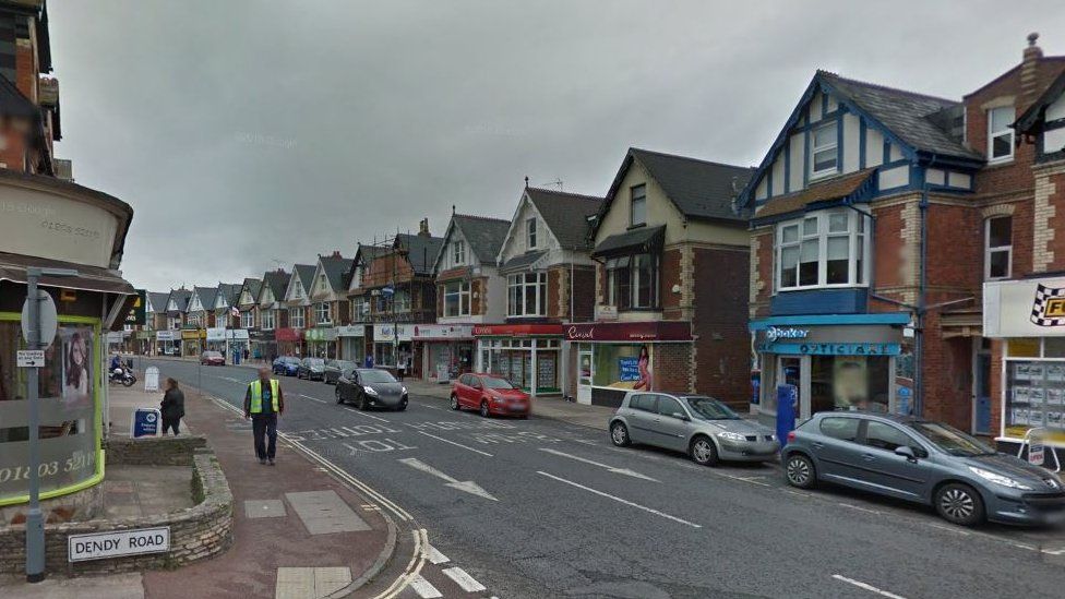 Woman 'critical' after car crashes into shop in Devon - BBC News