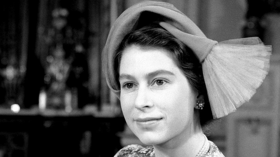 Princess Elizabeth with her baby daughter, Princess Anne, after the christening at Buckingham Palace