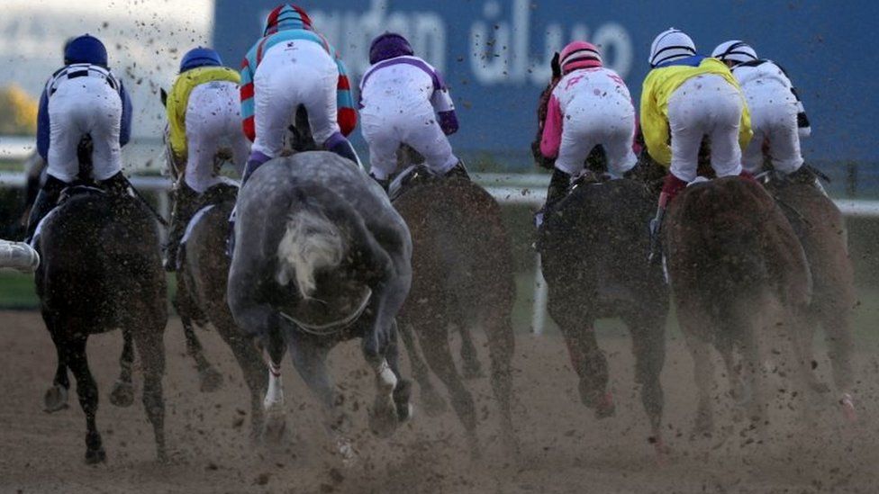 Jockeys compete in a race at the Dubai World Cup meeting 26/03/2016