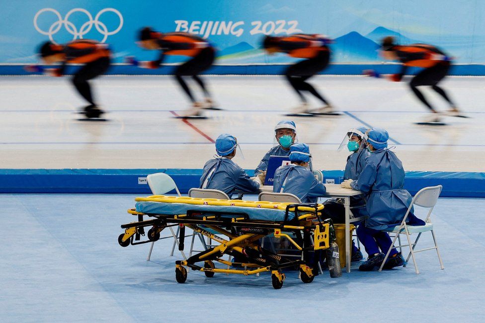 Medical staff on stand-by at a speed skating training session for the Winter Olympics in Beijing