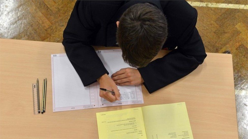 Boy doing exam paper