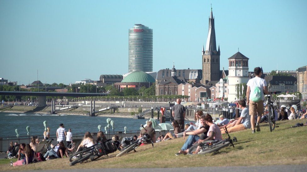People relaxing on the grass in Germany