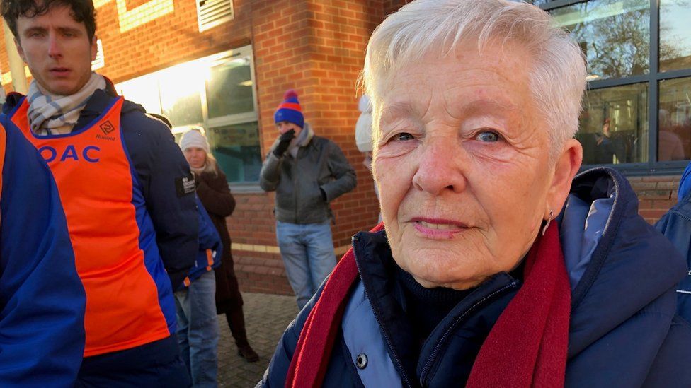 a woman outside a council building