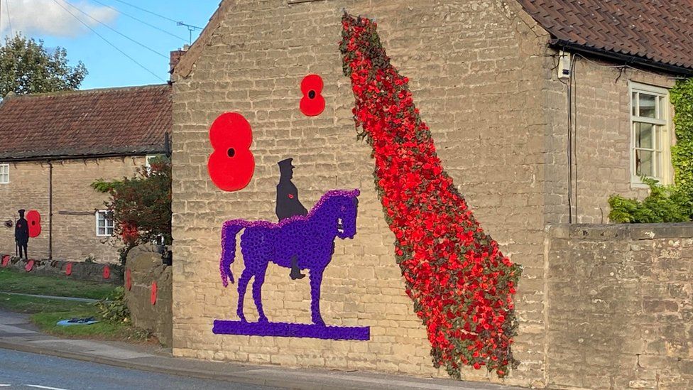 Purple horse and poppy display