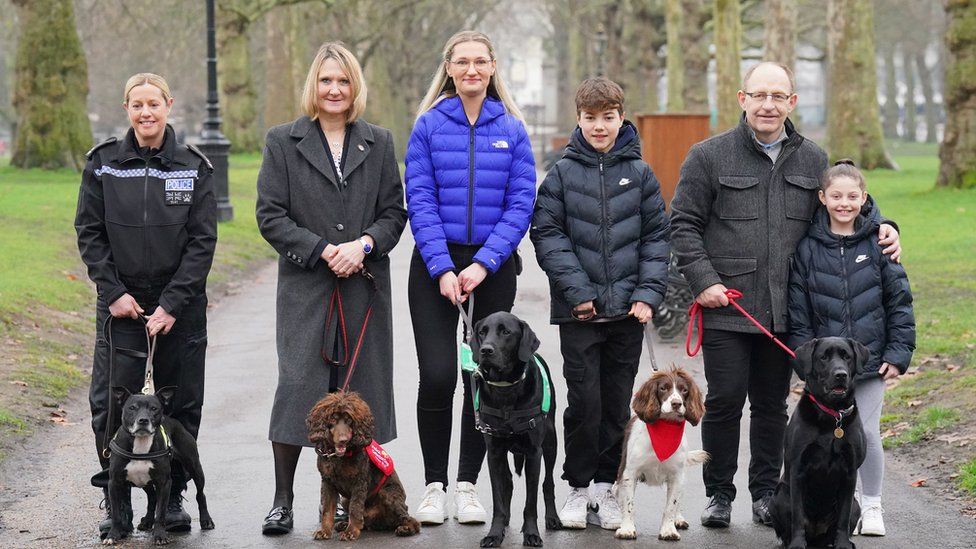 The finalists for the prestigious Crufts canine hero award with their owners (left to right) PC Claire Todd and Stella, Claire Guest and Asher, Jemima Banks and Albert, Ashley Owens and Bertie, and Wayne and Lily Bellamy with Beauty, at a launch event in Green Park, London, for Crufts 2023 and The Kennel Club's Hero Dog Award.