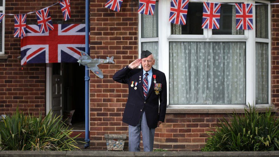 World War Two veteran Bernard Morgan, 96, stood outside his home for the two-minute silence
