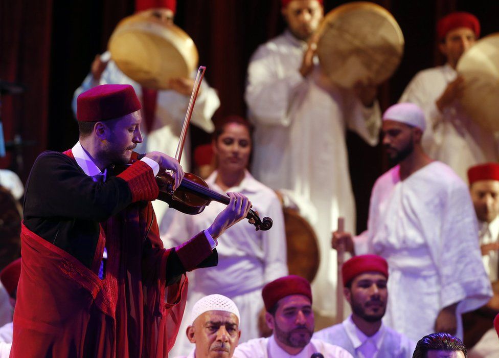 Tunisian members of the group El Hadhra Chants Soufis perform during the Festival de La Medina at the Municipal Theater in Tunis, Tunisia, 06 June 2017