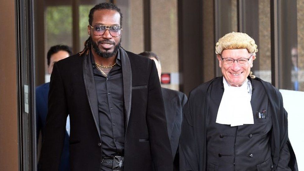 Chris Gayle with his lawyer outside court in Sydney
