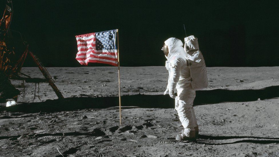 buzz aldrin by the flag in 1969