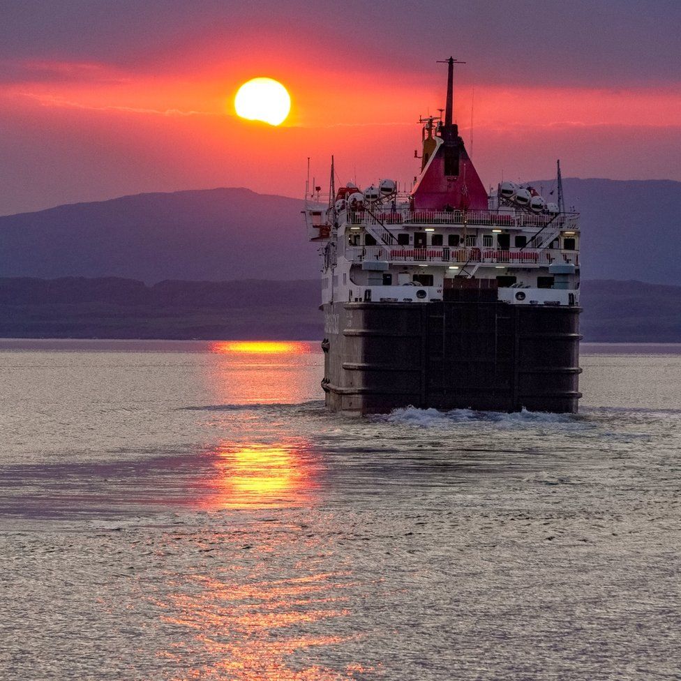 Ferry leaving Oban into sunset