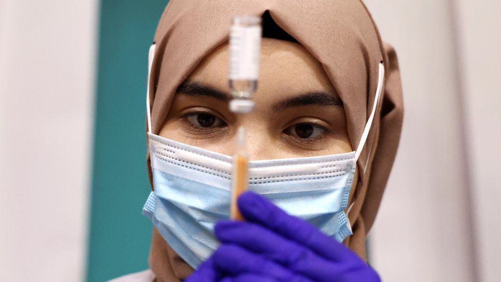 Nurse preparing a vaccine dose