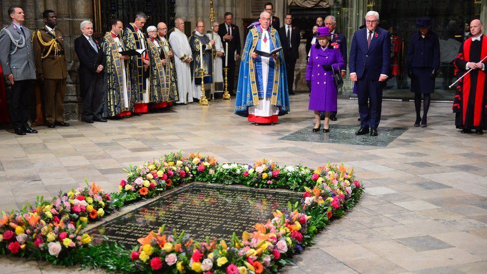 The Queen and senior royals attended Westminster Abbey on Sunday evening where flowers were laid on the grave of the Unknown Warrior