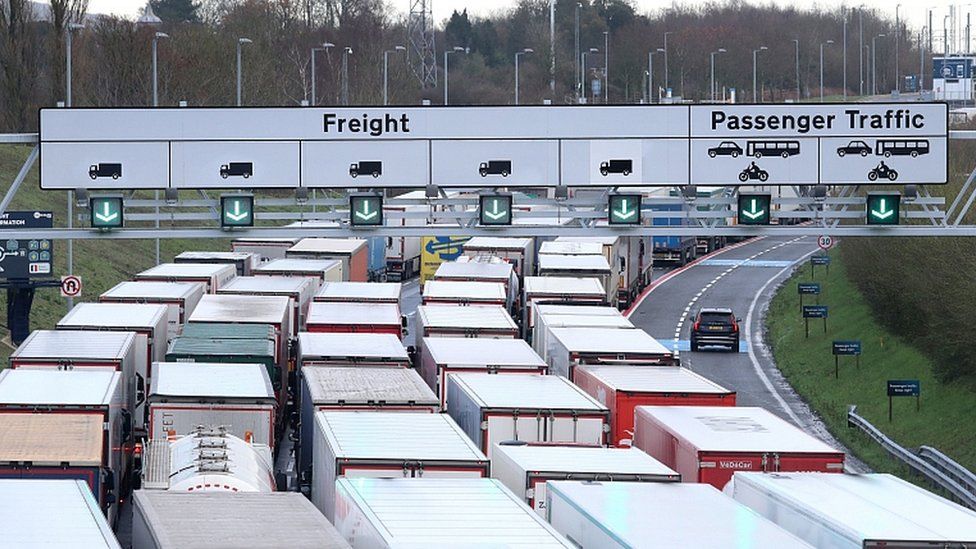 Lorries queue to access the Eurotunnel site near Folkestone in Kent