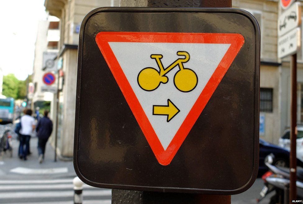 New Paris road sign showing bikes don't have to stop