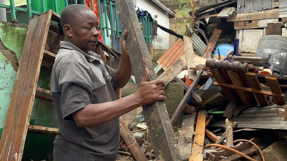 A man in a flood-damaged building in Dar es Saalaam