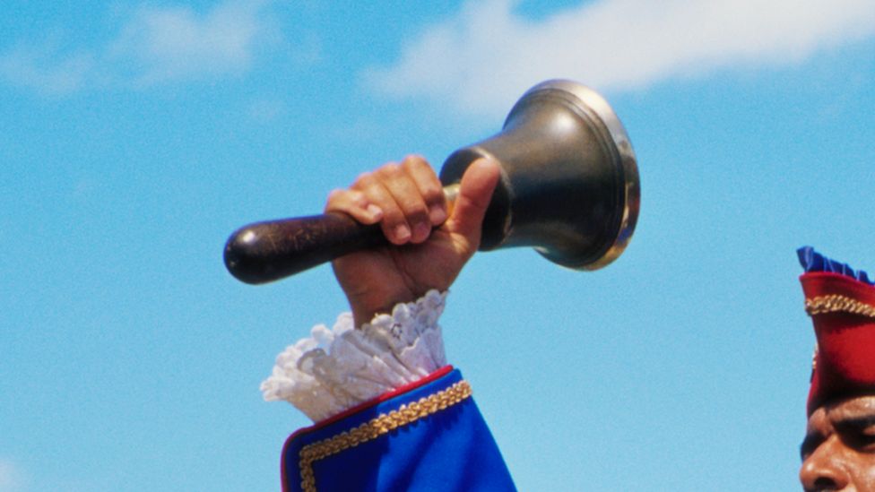 town crier with bell
