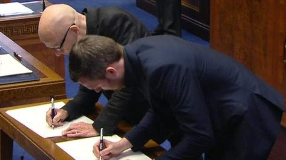People Before Profit Alliance pair Eamonn McCann and Gerry Carroll are two newcomers to Stormont and signed the roll of membership