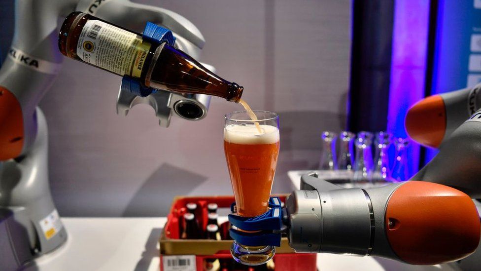 Robotic arm pouring a beer at G20
