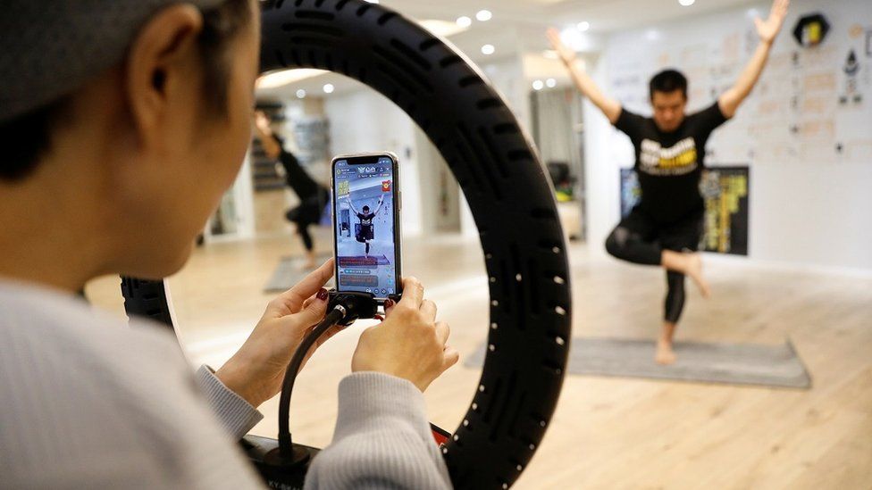 A Beijing exercise class is live-streamed