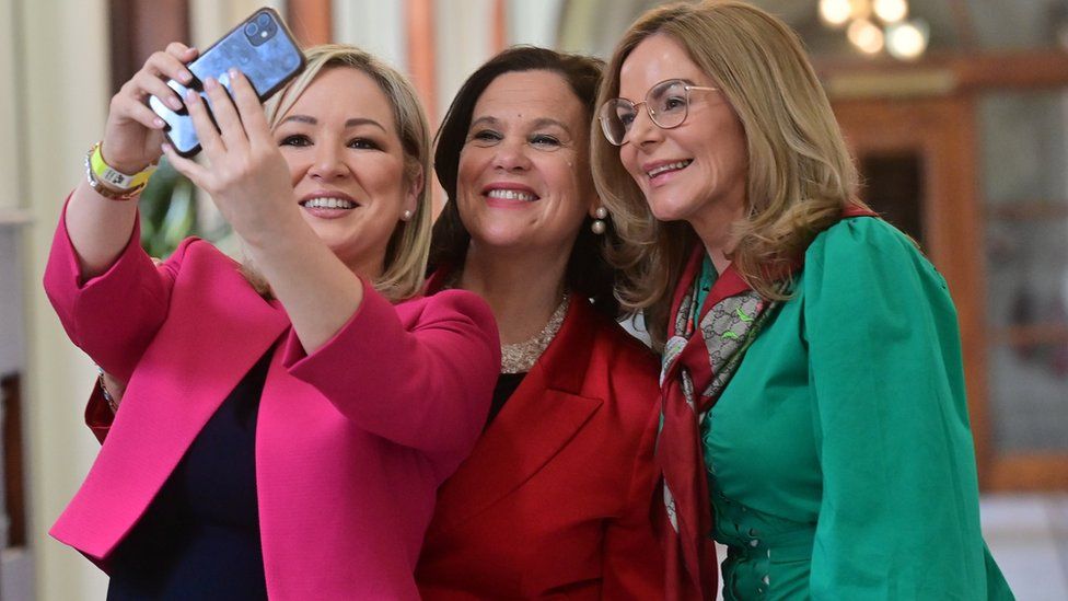 Sinn Fein's Michelle O'Neill, Mary Lou McDonald and Tina Black celebrate at Belfast City Hall