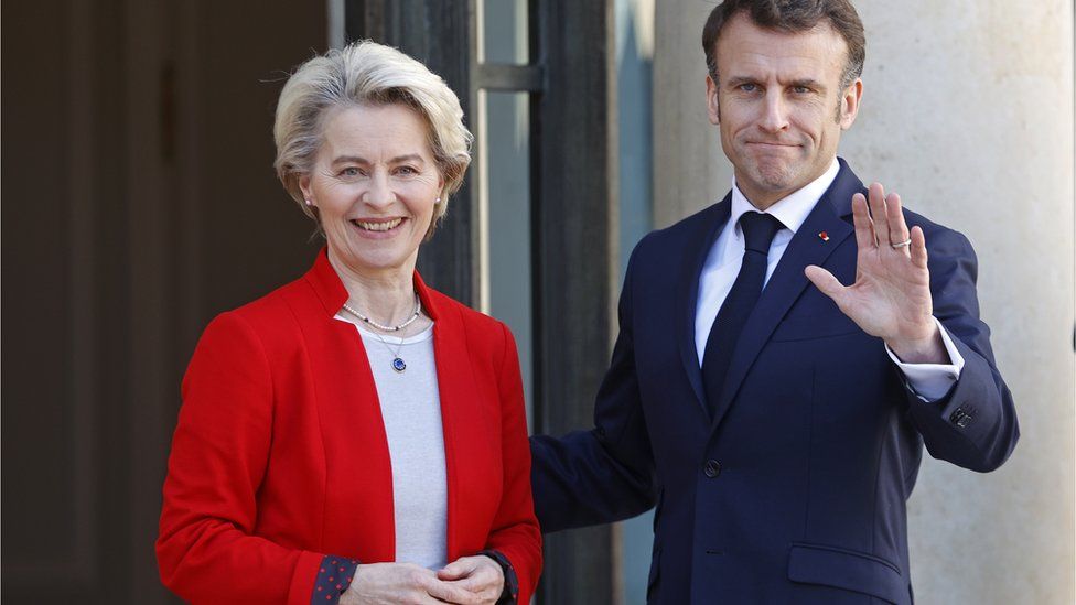 French President Emmanuel Macron (right) welcomes European Commission President Ursula von der Leyen at the Elysee Palace in Paris