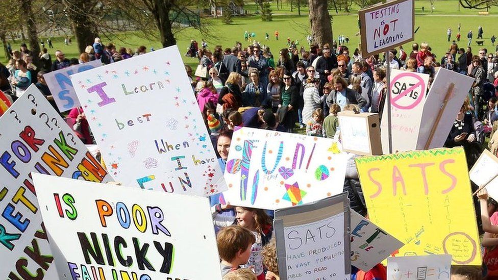Parents hold a rally with their children in Preston Park, Brighton