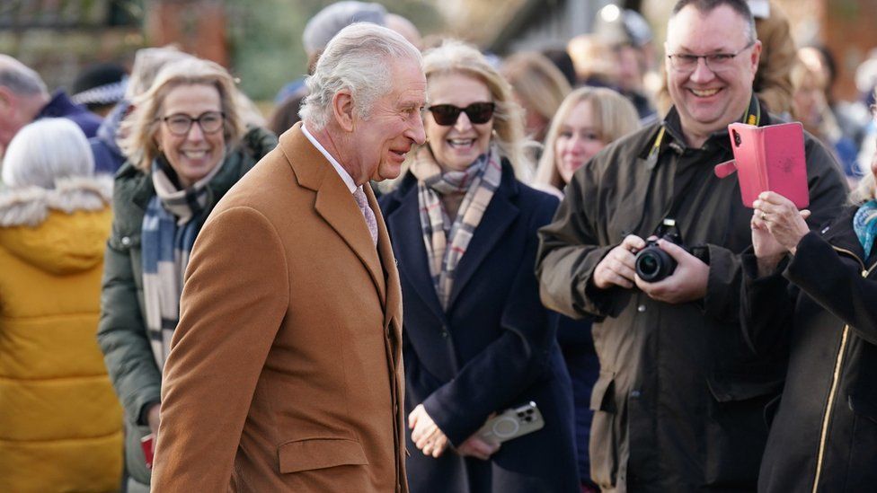 Prince Charles smiling as he meets with the public outside of Castle Rising Church in Norfolk