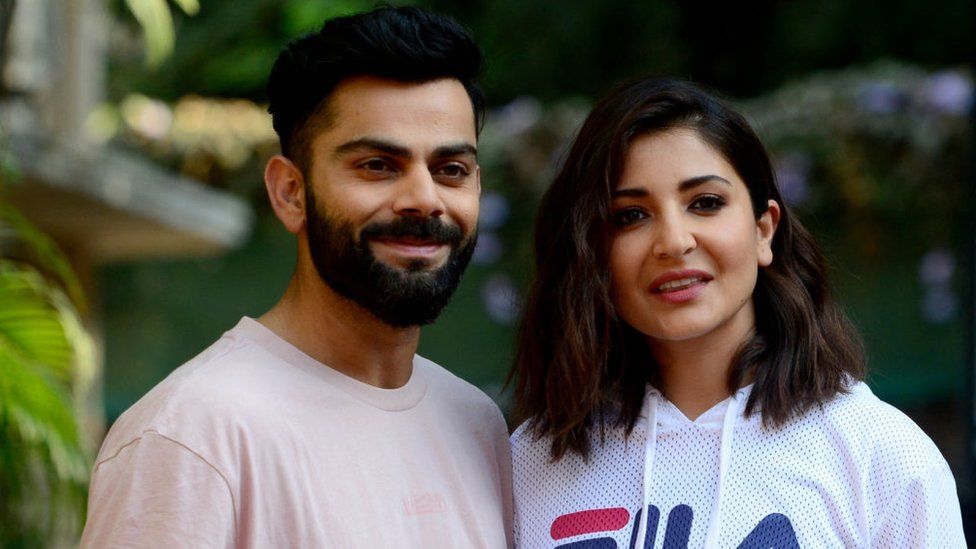Indian cricketer Virat Kohli (L) with his wife Bollywood actress Anushka Sharma attends a promotional event in Mumbai on February 23, 2022. (Photo by SUJIT JAISWAL / AFP) (Photo by SUJIT JAISWAL/AFP via shabby graphics)