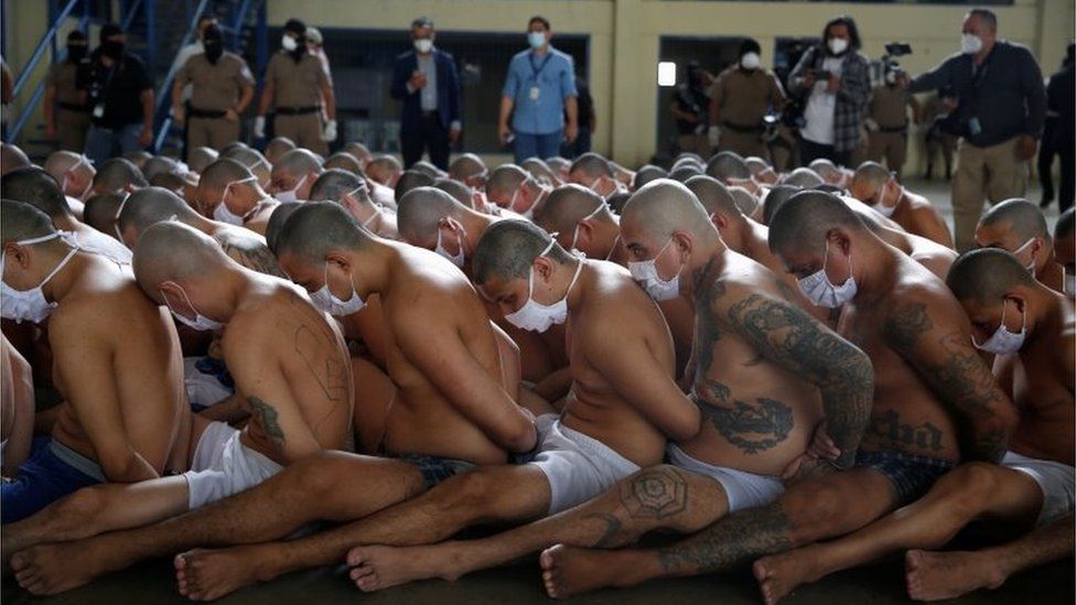 Gang members wait outside their cells during a search at the Izalco jail during a media tour, in Izalco, El Salvador September 4, 2020.