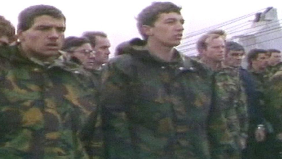 Mike Hermanis (left in picture) as a 19-year-old Guardsman at the service for those lost on the Sir Galahad