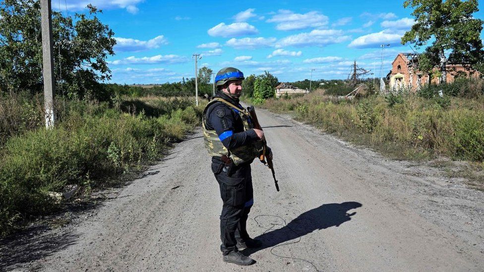A Ukrainian soldier in a retaken area
