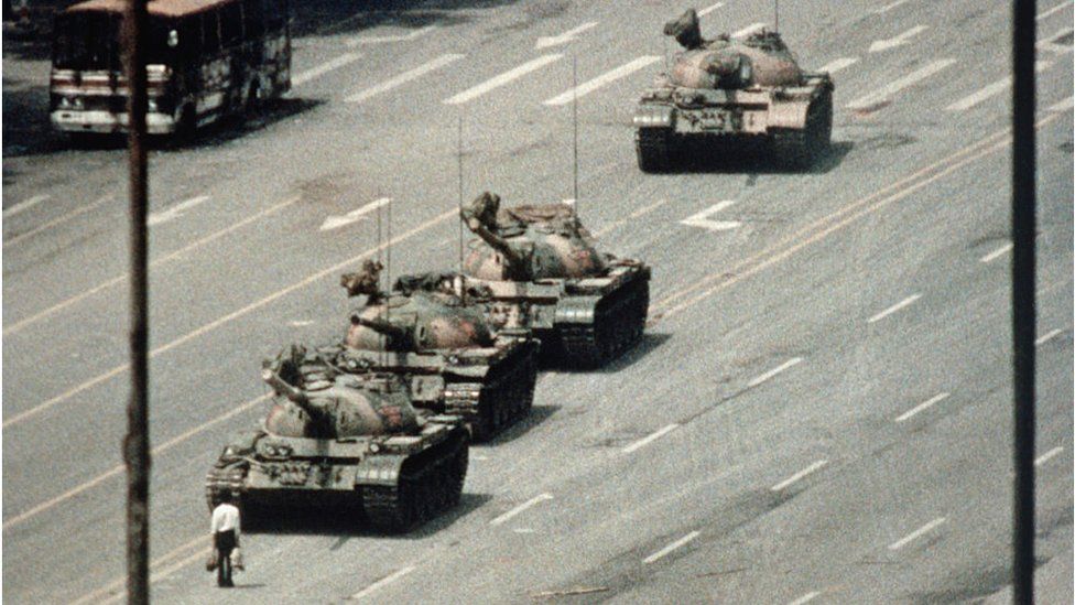 A Beijing demonstrator blocks the path of a tank convoy along the Avenue of Eternal Peace near Tiananmen Square in 1989. For weeks, people have been protesting for freedom of speech and of press from the Chinese government.