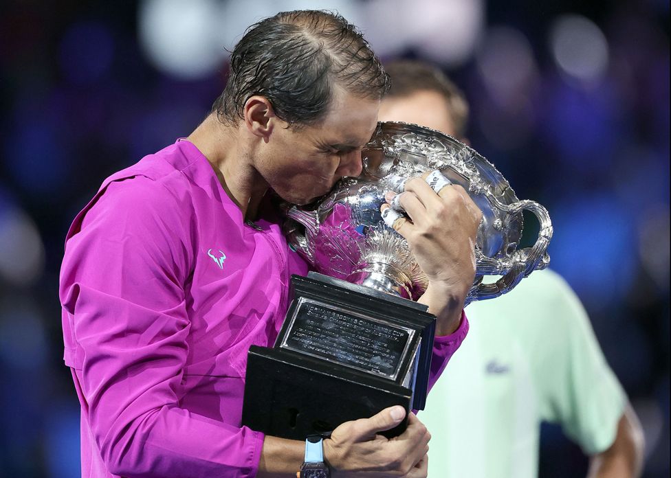Rafael Nadal kisses the Norman Brookes Challenge Cup trophy following his victory at the Australian Open tennis tournament in Melbourne