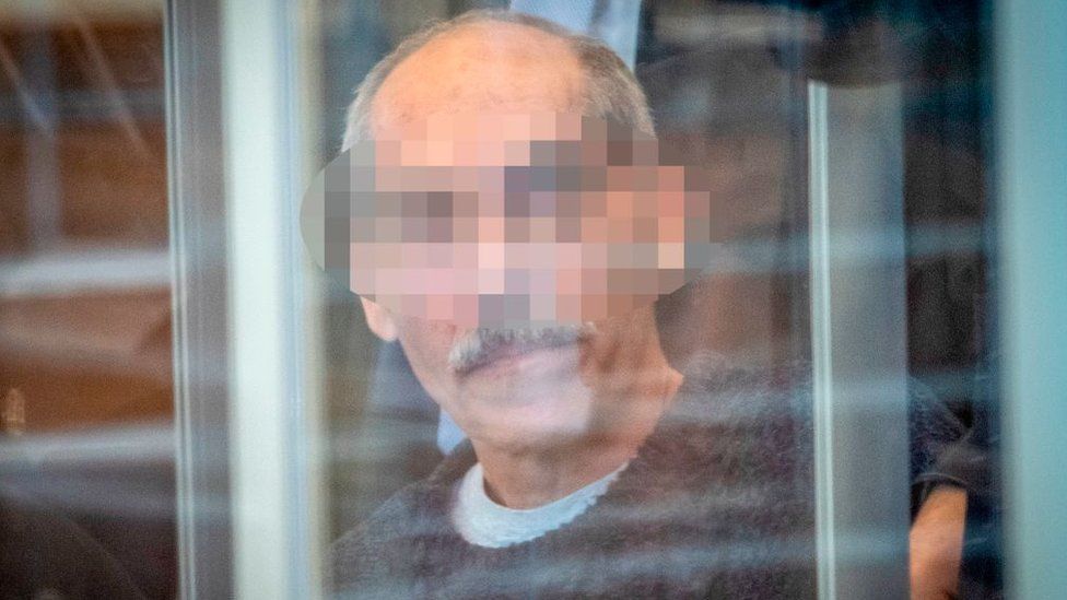 Syrian defendant Anwar Raslan arrives at court for an unprecedented trial on state-sponsored torture in Syria, on April 23, 2020 at court in Koblenz, western Germany