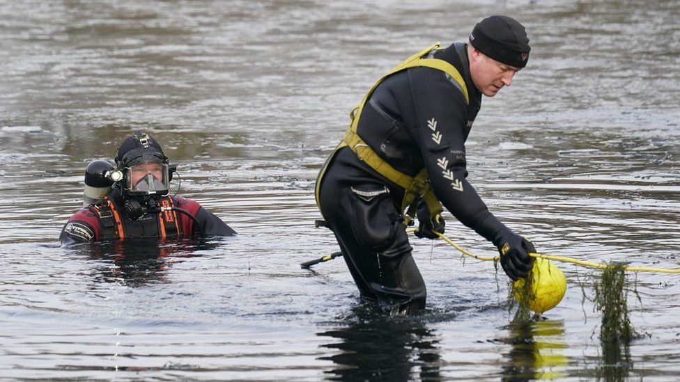 Police divers search the lake in Babbs Mill Park in Kingshurst, Solihull