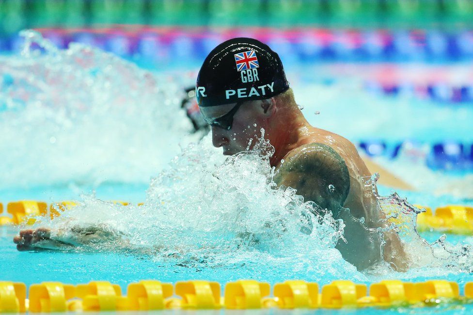 Adam Peaty of Great Britain competes in the Men's 100m Breaststroke Final