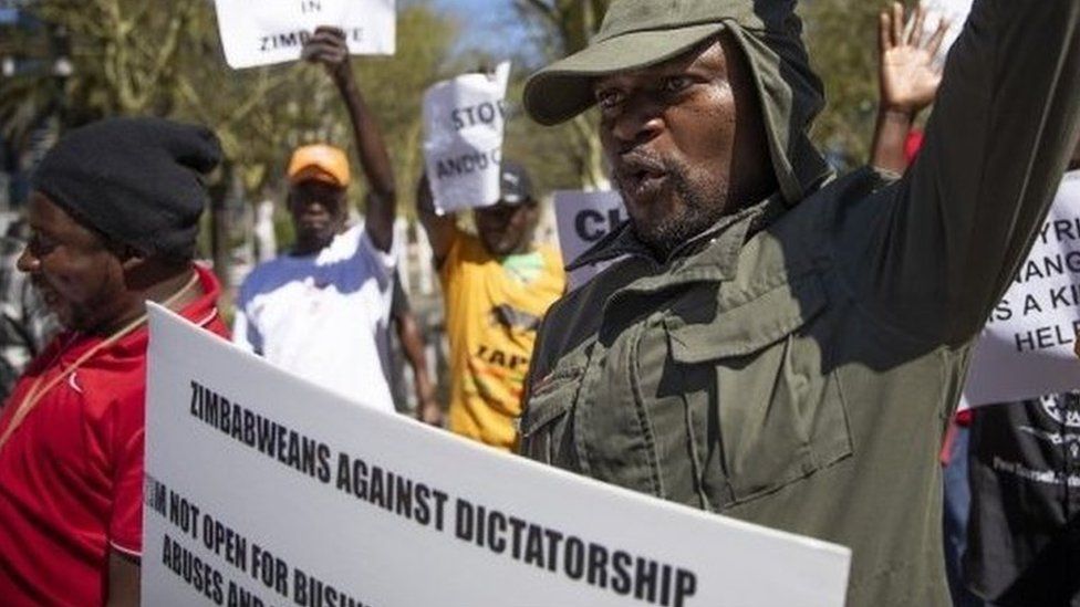Zimbabweans in South Africa celebrate Mugabe's death