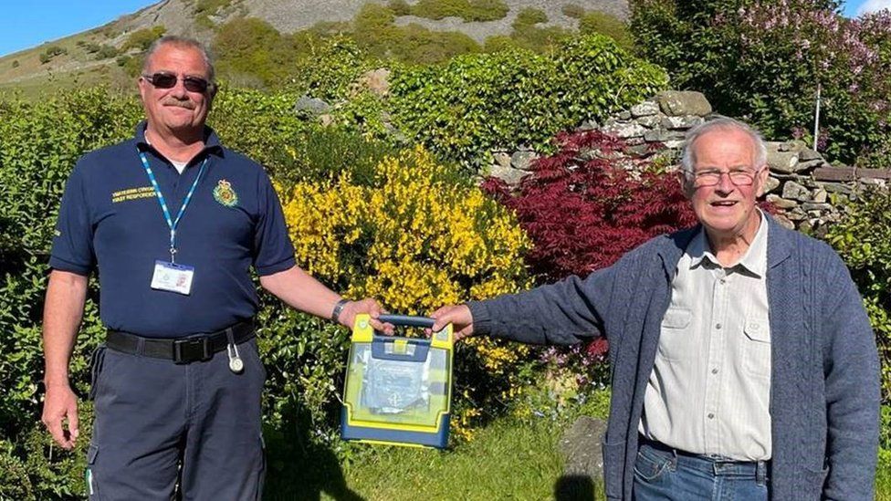 David White, from the Welsh Ambulance Service, with David John Pryde