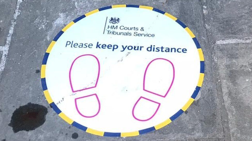 Please keep your distance sign