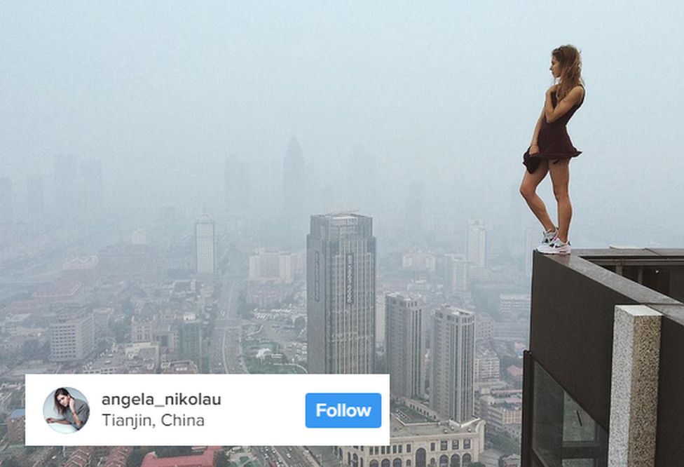 Angela Nikolau standing on the edge of a building in China