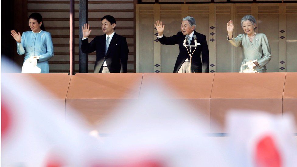 Japan's Emperor Akihito, third from left, waves with Empress Michiko, right, Crown Prince Naruhito and Crown Princess Masako, to well-wishers from a balcony during a New Year's public appearance at the Imperial Palace in Tokyo. 2 January 2014.