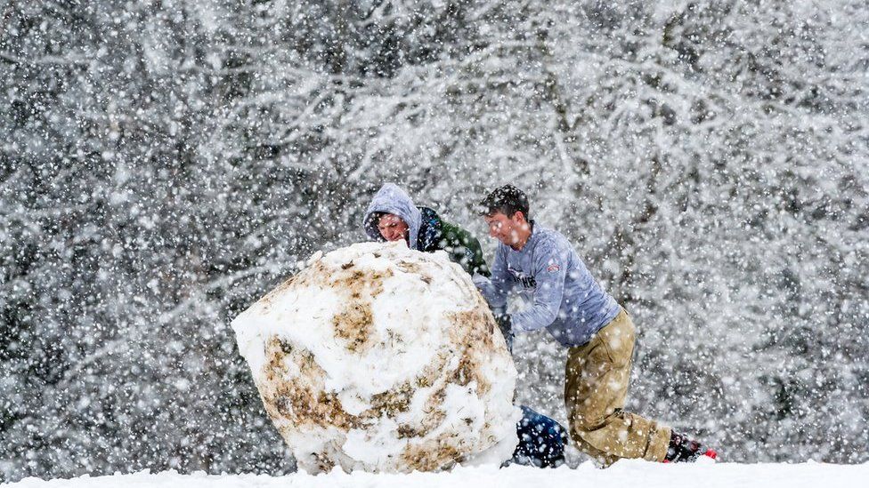 Rolling a giant snowball down the hill at South Park.