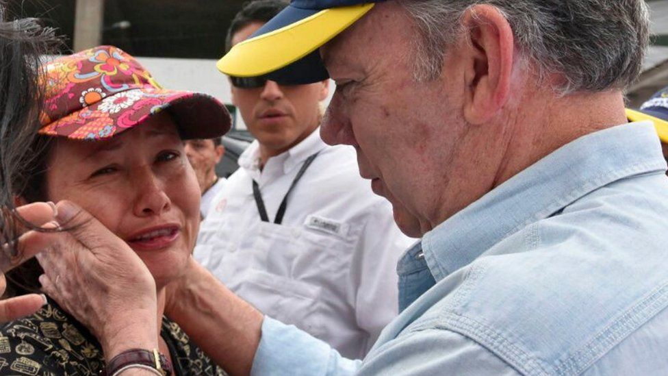 President Juan Manuel Santos (right) went to visit the affected area and meet residents