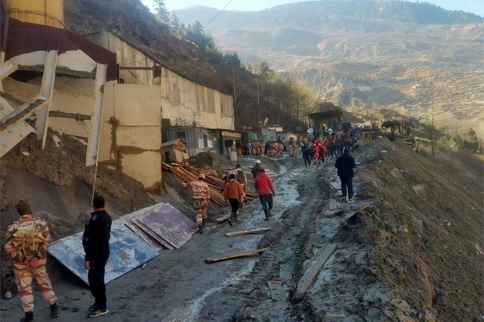 Rescue team members work outside a tunnel after a part of a glacier broke away and caused flood in Tapovan, northern state of Uttarakhand, India, February 8, 2021