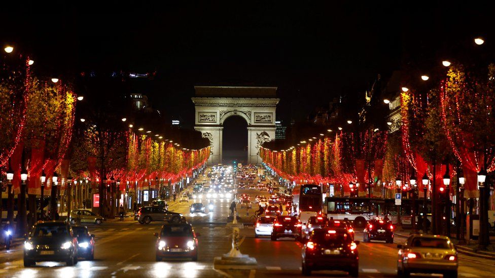 A picture taken on November 23, 2020 shows the Champs Elysees avenue illuminated