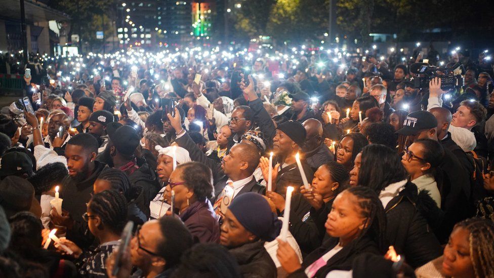 People attend a vigil outside the Whitgift shopping centre in Croydon, south London, for Elianne Andam