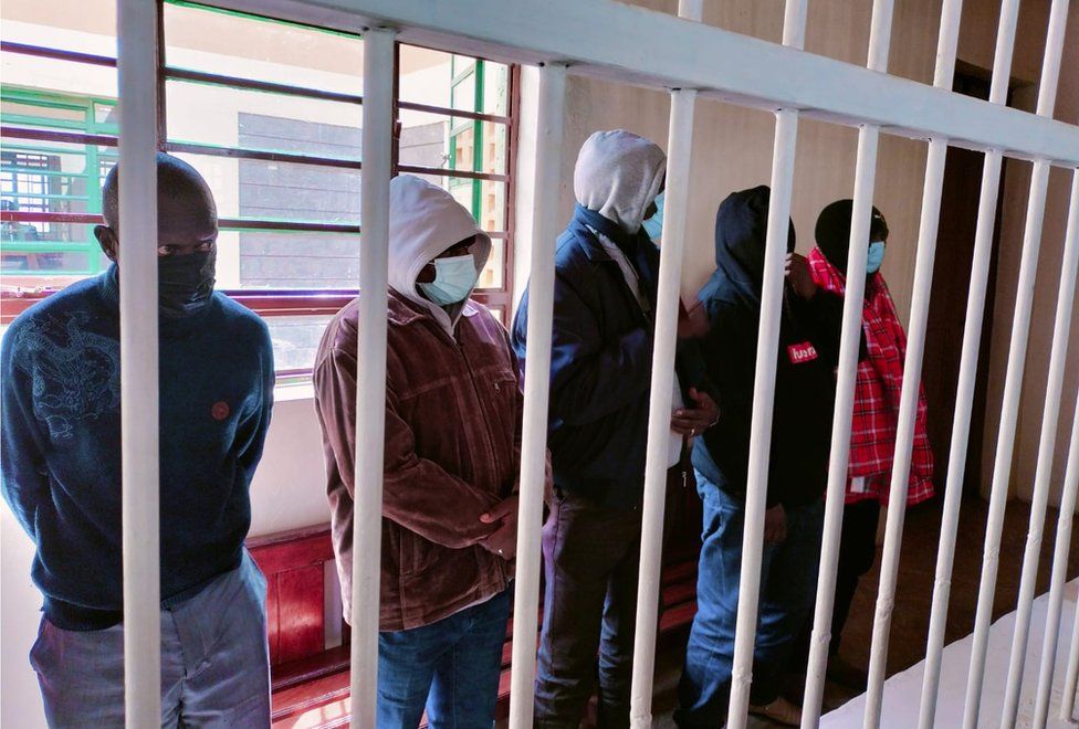 Four men have been accused of killing of two Indians and their Kenyan taxi driver.
