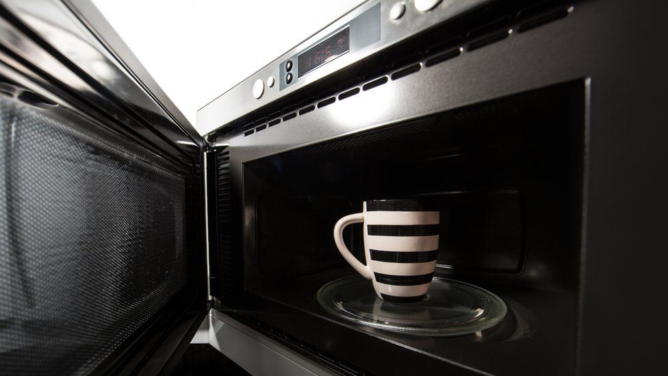Coffee mug in microwave oven