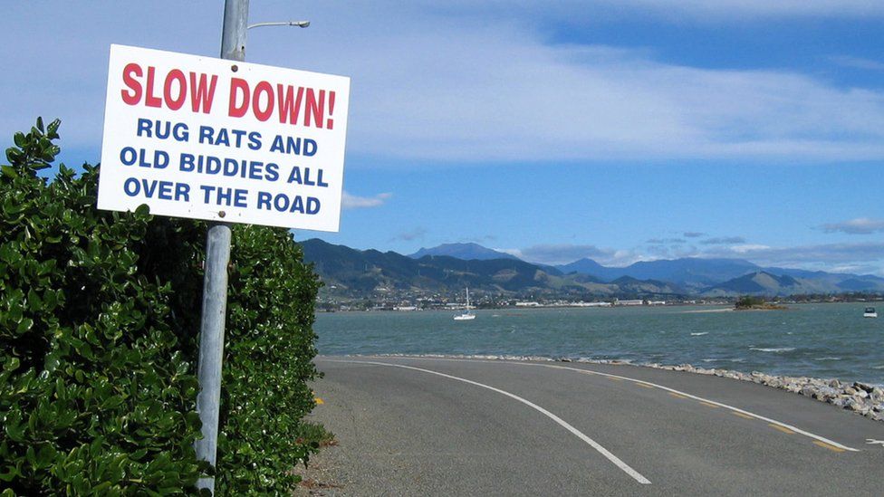 Slow down sign in New Zealand