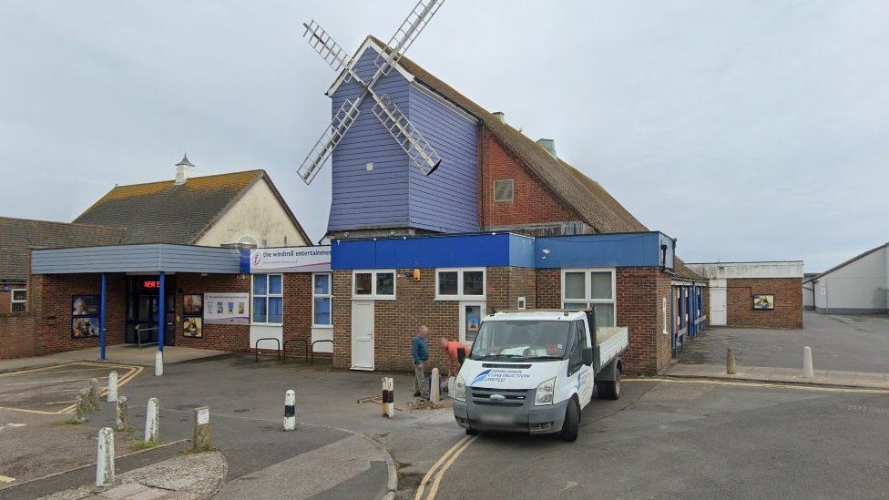 The Windmill Entertainment Centre - a building with a blue windmill attached